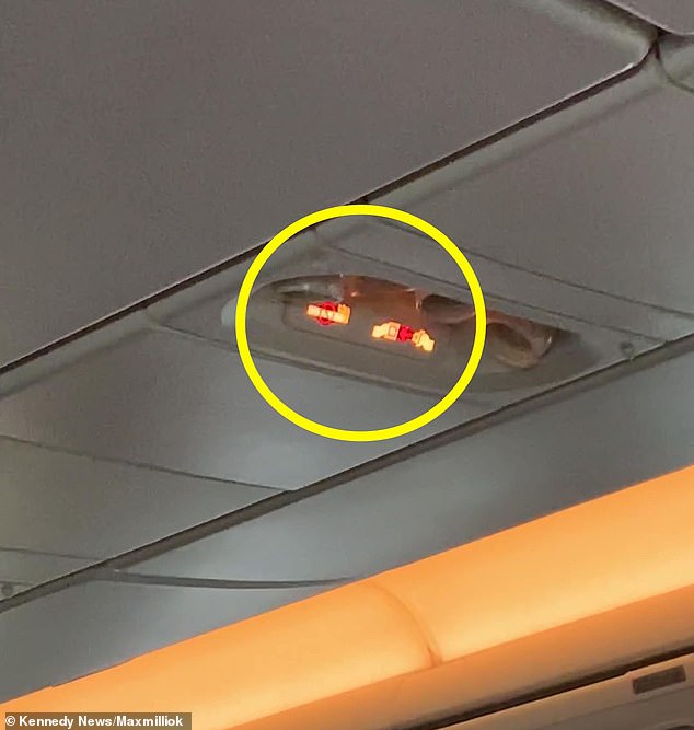 The man only stopped preaching after the seatbelt signs (pictured) were turned on by staff and he had to sit down