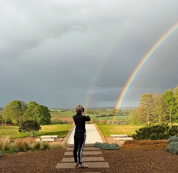 The Ally McBeal actress was seen in a sweater, sweatpants and slides in the backyard