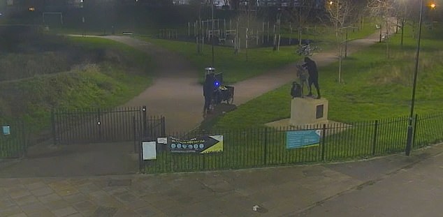 Four suspects were filmed at the scene in Langdon Park, Poplar - all dressed in black with their faces covered and wiggling the statue free from its stone plinth