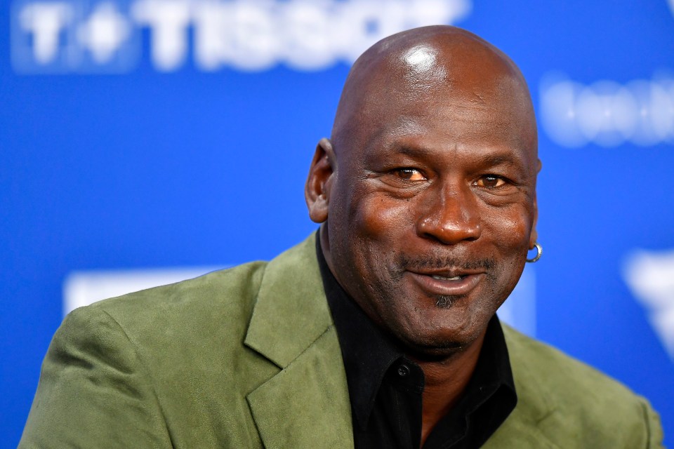 Michael Jordan, smiling, at the NBA Paris Game.