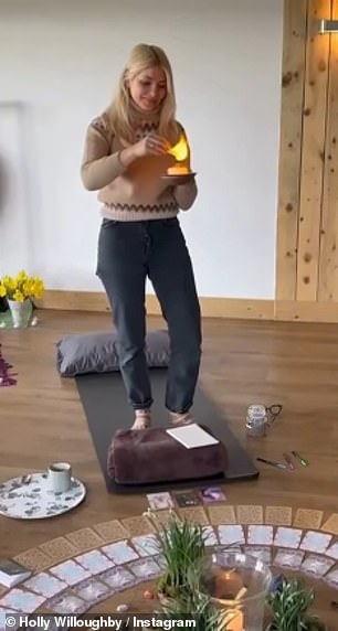 Holly captioned the clip: 'We drank the Sacred Cacao to open our hearts, selected oracle cards for guidance and crafted reed dollies as blessings of renewal & protection'