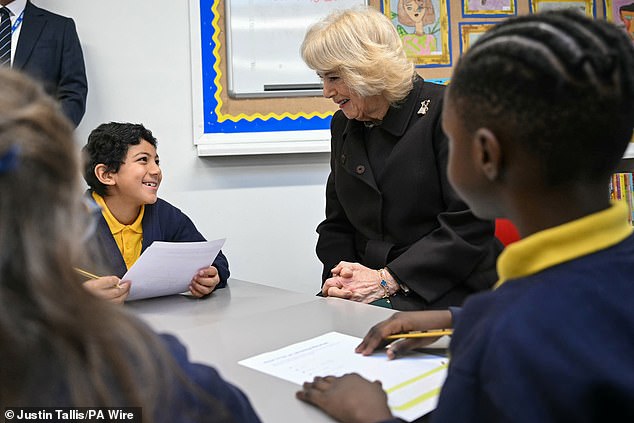The Queen's visit (pictured) marks the first Coronation Library to open in a school during the 2026 National Year of Reading, a Department of Educational and National Literacy Trust initiative which aims to reconnect people of all ages with a love of books