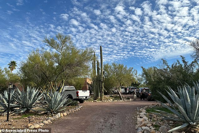 Law enforcement officers are present outside the home of Nancy Guthrie, the mother of "Today" host Savannah Guthrie, near Tucson
