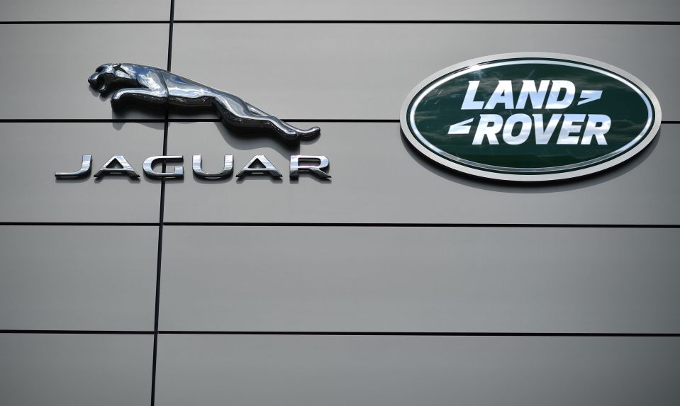 Jaguar and Land Rover logos on the exterior of a showroom.