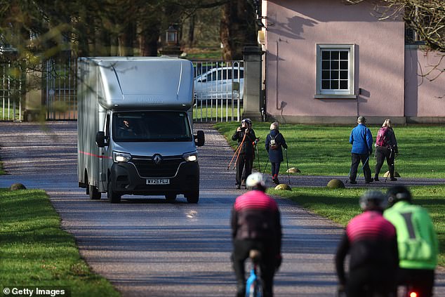 A removals van leaves the gates of Royal Lodge in Windsor Great Park on Wednesday