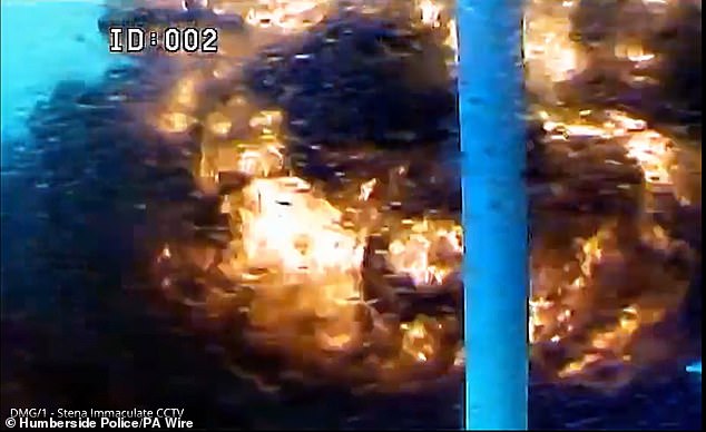 American crew members were heard shouting: 'Holy s***... what just hit us... a container ship... this is no drill, this is no drill, fire fire fire, we have had a collision'