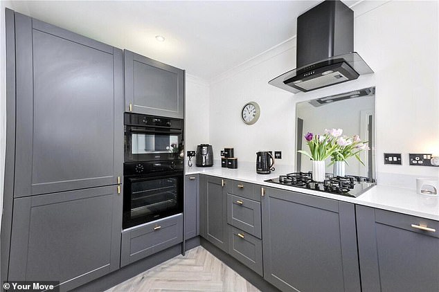 One picture of the kitchen appears to show the cupboards bulging and a vase placed in the middle of the hob