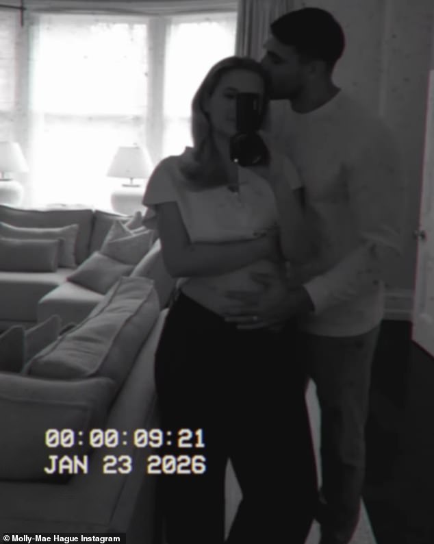 Tommy cradled Molly's bump as they kissed to mark the start of an exciting new chapter