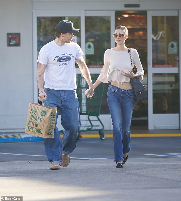 Nicola opted for a cream crop top and a pair of dark skinny jeans