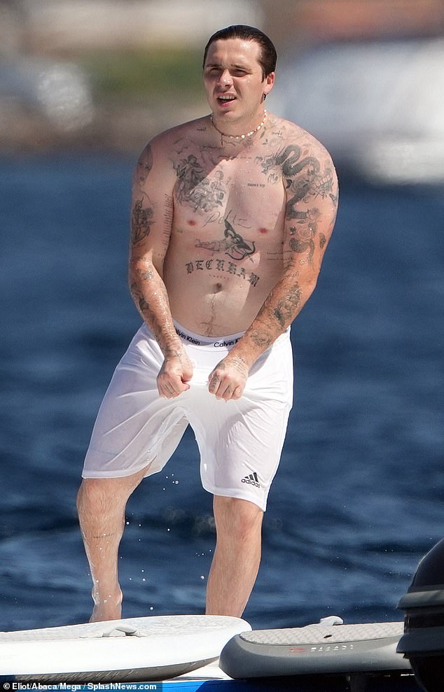 Brooklyn has 'Love you Bust' tattooed on his right arm (Brooklyn shows off his many inkings in 2023)