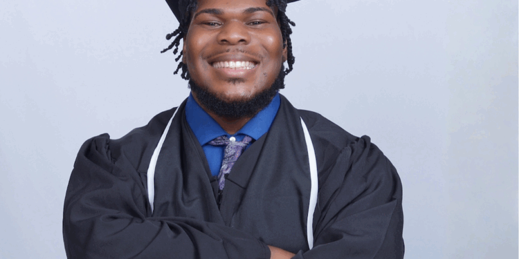 Tyler Stanley smiling in cap and gown.