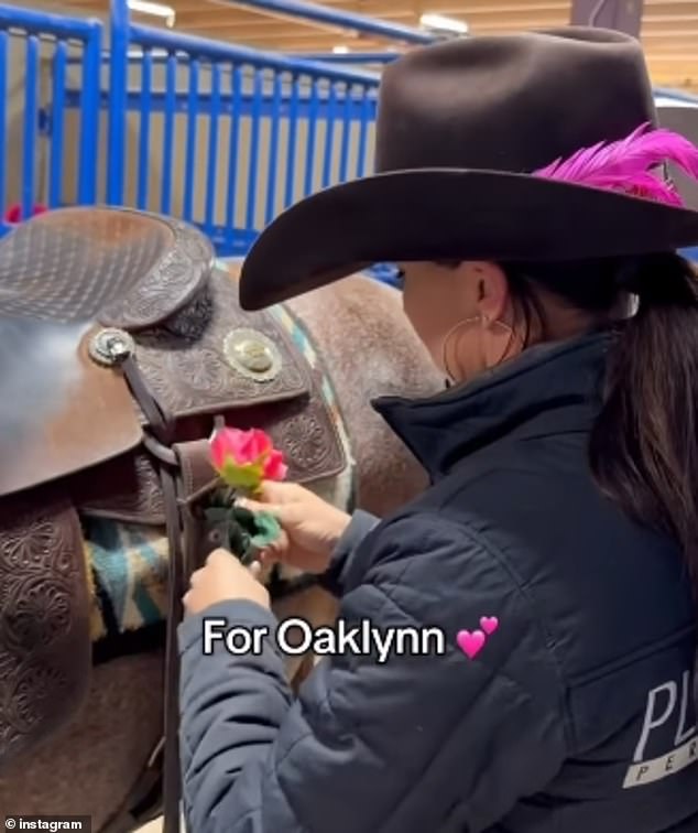 Domer's team, Taormino Performance Horses, shared a video of a rider placing pink flowers in her horse's saddle in honor of Oaklynn