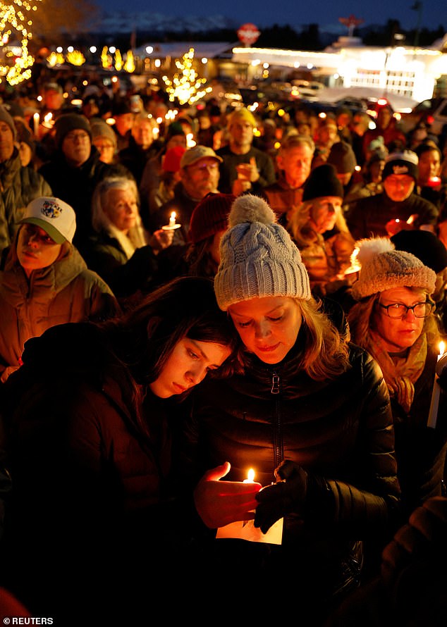 Mourners attend a candlelight vigil for victims of a deadly avalanche on Sunday night
