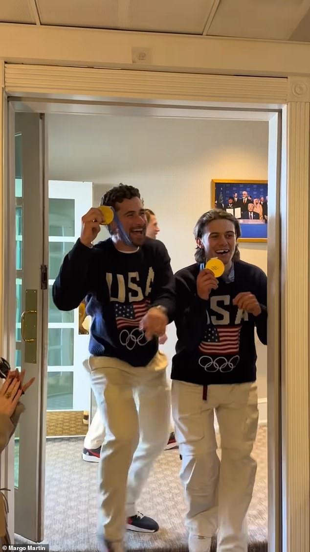 Stars leaned into the press office's open door to flash the medals from their win over Canada