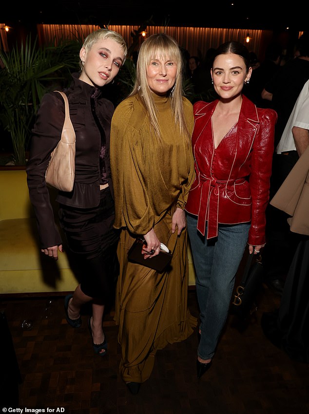 Lucy Hale caught the eye in a bold red leather jacket which she cinched in at the waist as she posed with Emma Chamberlain who looked effortlessly cool in a brown co-ord