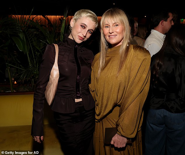 Emma was all smiles as she posed with Amy at the bash