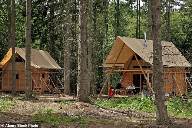 Huttopia sits at the more outdoorsy, eco-conscious end of the holiday park spectrum. Pictured: canvas and wood tent in at Huttopia Senonches campsite, Senonches, Eure-et-Loir, France