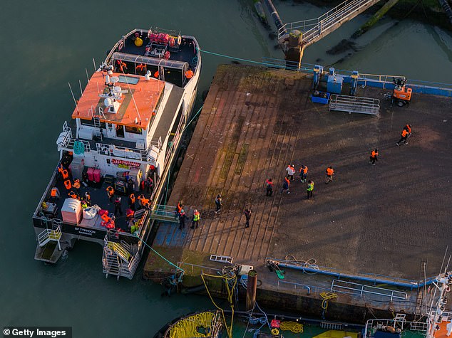 Migrants disembark from a Border Force vessel in Ramsgate port on February 25, 2026