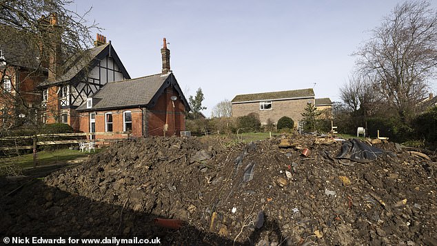 Pictured: The view from Lorie's home - she has been left furious after her new neighbours were granted permission to build a five-bedroom house just inches from her garden