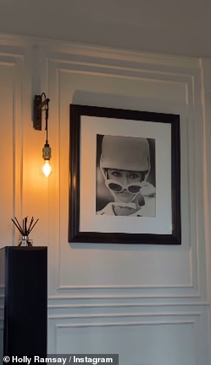 Holly, 25, gave a glimpse into the home's chic interiors in the clip, from an array of stunning artwork on the walls