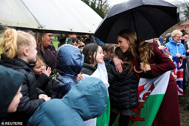 Kate pictured greeting children as she arrived at Oriel Davies, a contemporary art gallery in Newtown