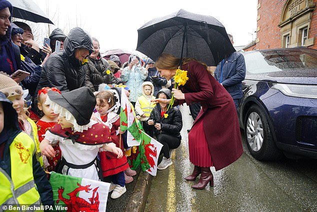 Daffodils ⁠– the main national symbol of Wales ⁠– were very much the theme on this late Winter day as Kate was passed bouquets by excited punters queueing up for a chance to see the royals