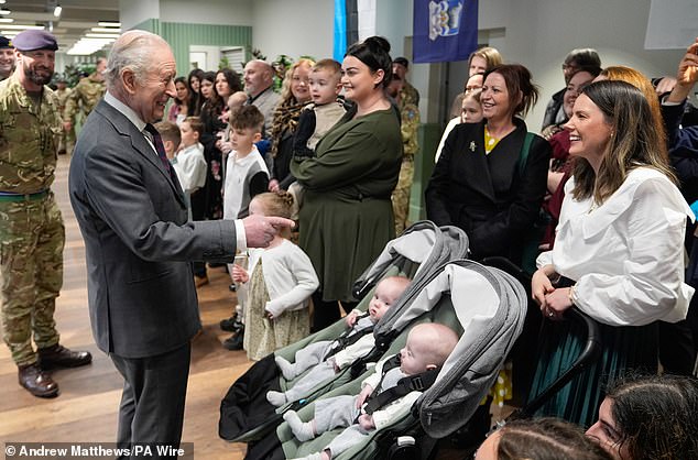 Charles was pictured laughing as he met with families of personnel serving abroad during the visit