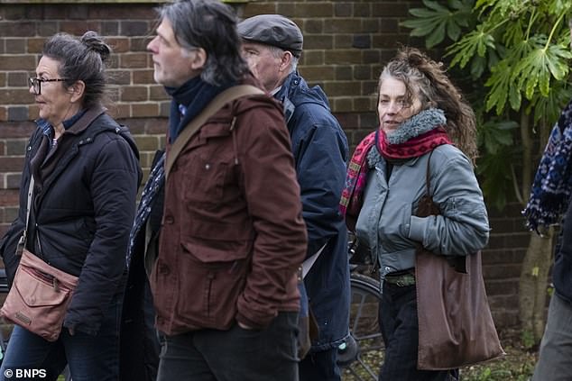 Ruth McGil (pictured in green jacket, right) arriving at County Hall Dorchester on Thursday