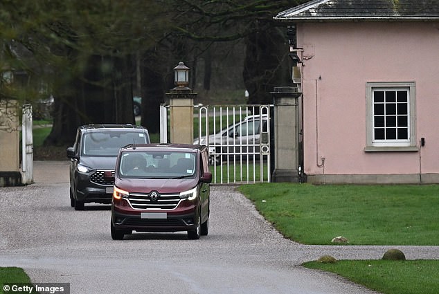 Unmarked police vehicles exit the gates of Royal Lodge after carrying out searches at two properties linked to Andrew