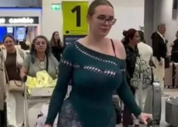 Traveller turns heads with VERY revealing outfit, as people rage there 'should be a dress code' for airports & flights