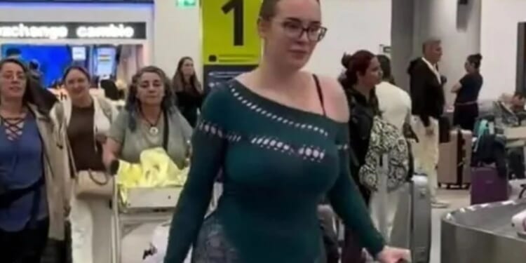Traveller turns heads with VERY revealing outfit, as people rage there 'should be a dress code' for airports & flights