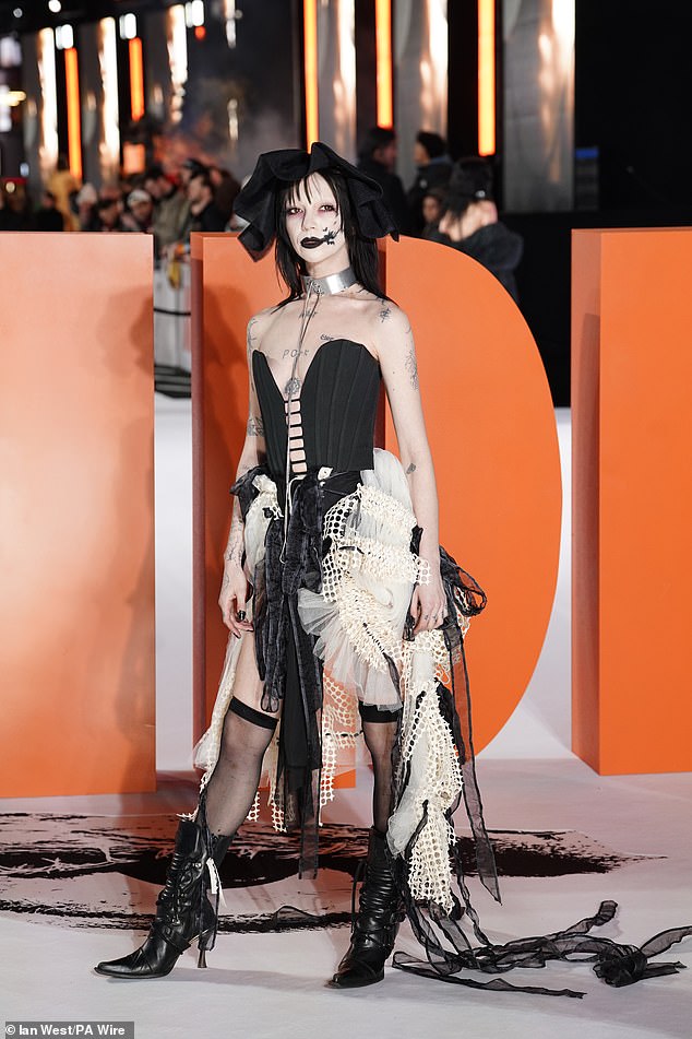 Eurovision star Bambie Thug cut an edgy figure as they arrived for the premiere in a distressed fabric look