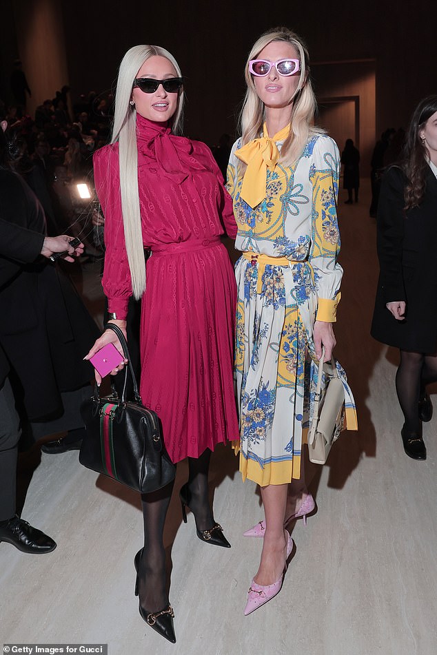 Paris Hilton and sister Nicky opted for bold and colourful dresses as they attended the show