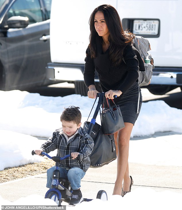 United States Representative Lauren Boebert, a 39-year-old grandmother, arrives with her grandson at the entrance to the Chappaqua Performing Arts Center where former President Bill Clinton is set to be deposed by the House Oversight Committee regarding Jeffrey Epstein
