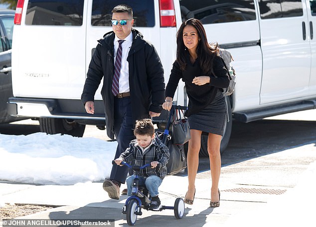 Boebert braves the snowy weather in leopard-print heels and a skirt as she tows her grandson along for Clinton's Epstein hearing in Chappaqua on Friday