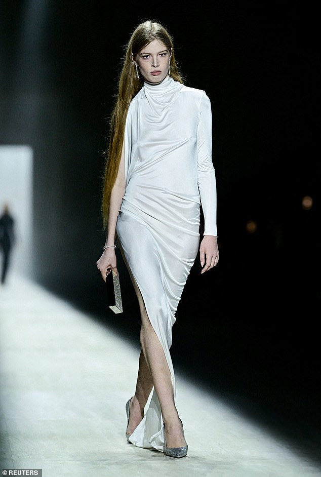 The 21-year-old, who has been estranged from the Tesla founder since 2020, wore a white Gucci one-sleeved dress that boasted a high neck and side split