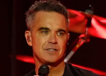 Robbie Williams ends feud with Gary Barlow as he emotionally reveals he apologised for his 'smug' behaviour