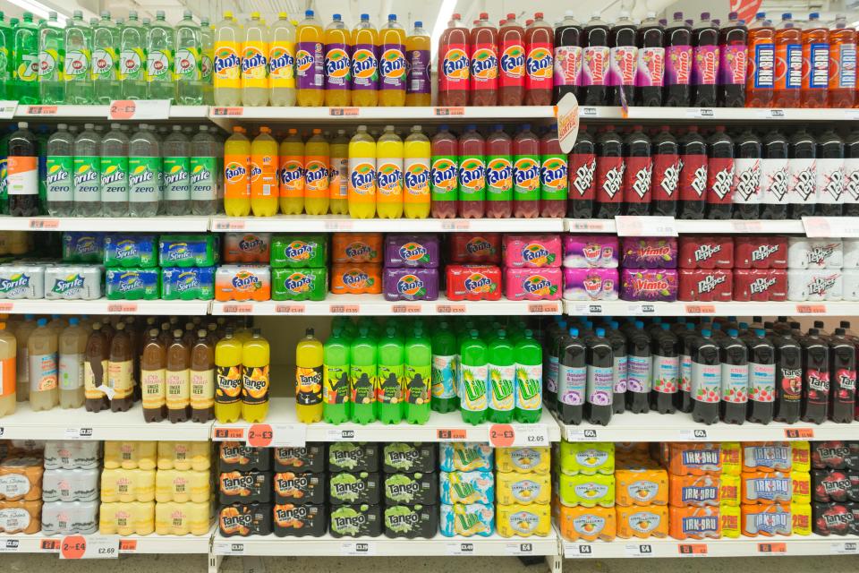 Variety of soft drinks on supermarket shelves