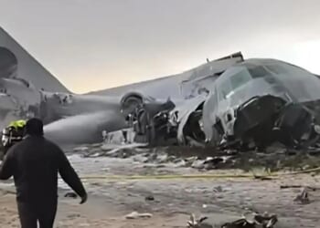 Military cargo plane carrying cash smashes onto road & hits cars killing 15 as looters pick up scattered money