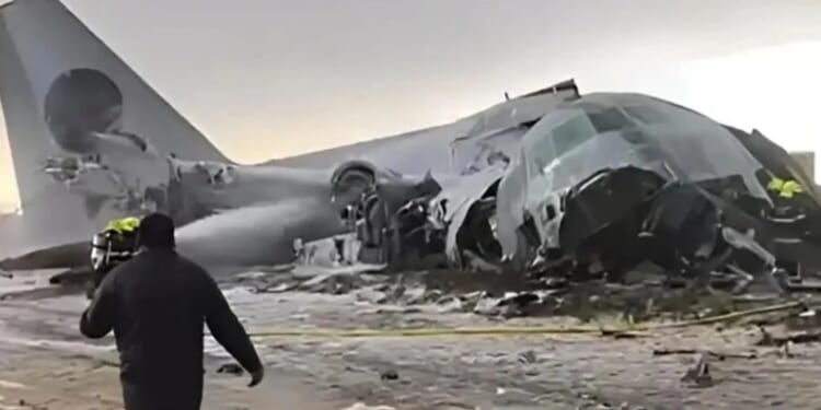 Military cargo plane carrying cash smashes onto road & hits cars killing 15 as looters pick up scattered money