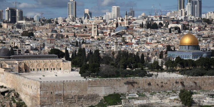 Iran launches barrage of missiles at Israel as air raid sirens ring out in Tel Aviv after Tehran vowed revenge