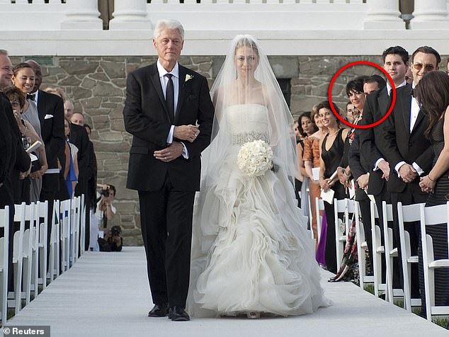 President Bill Clinton walks his daughter Chelsea down the aisle during her wedding to Marc Mezvinsky at Astor Court in Rhinebeck. Jeffrey Epstein associate Ghislaine Maxwell, one of the guests, is circled