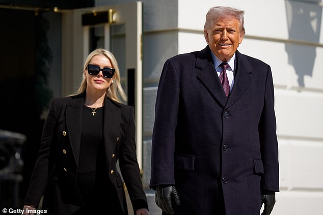 Donald Trump, accompanied by White House press secretary Karoline Leavitt, walks towards the media as he departs on Marine One on the South Lawn of the White House on Friday