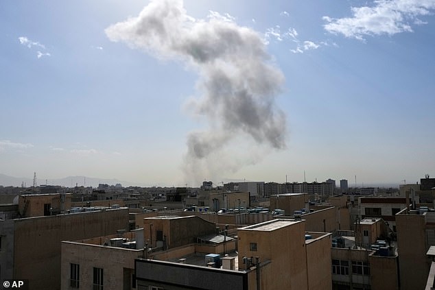 Israel Katz, the Israeli Defense Minister, announced that the country is under a state of emergency as thick smoke rose from an explosion in downtown Tehran (pictured)