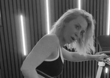 A Place In The Sun's Laura Hamilton works up a sweat in tiny bra and leggings as she shows off flexibility