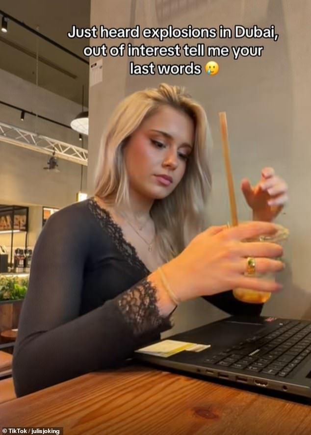 18-year-old influencer Julis, shared a clip of herself working on a laptop in a café, shortly after 'hear[ing] explosions in Dubai'.