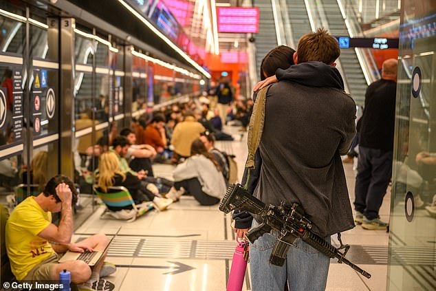 More Israeli's taking shelter at an underground train station as they prepare for retaliatory missile strikes
