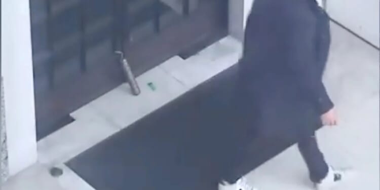 Moment asylum seeker sparks terror alert leaving 'fake stick of dynamite' outside MI5 base