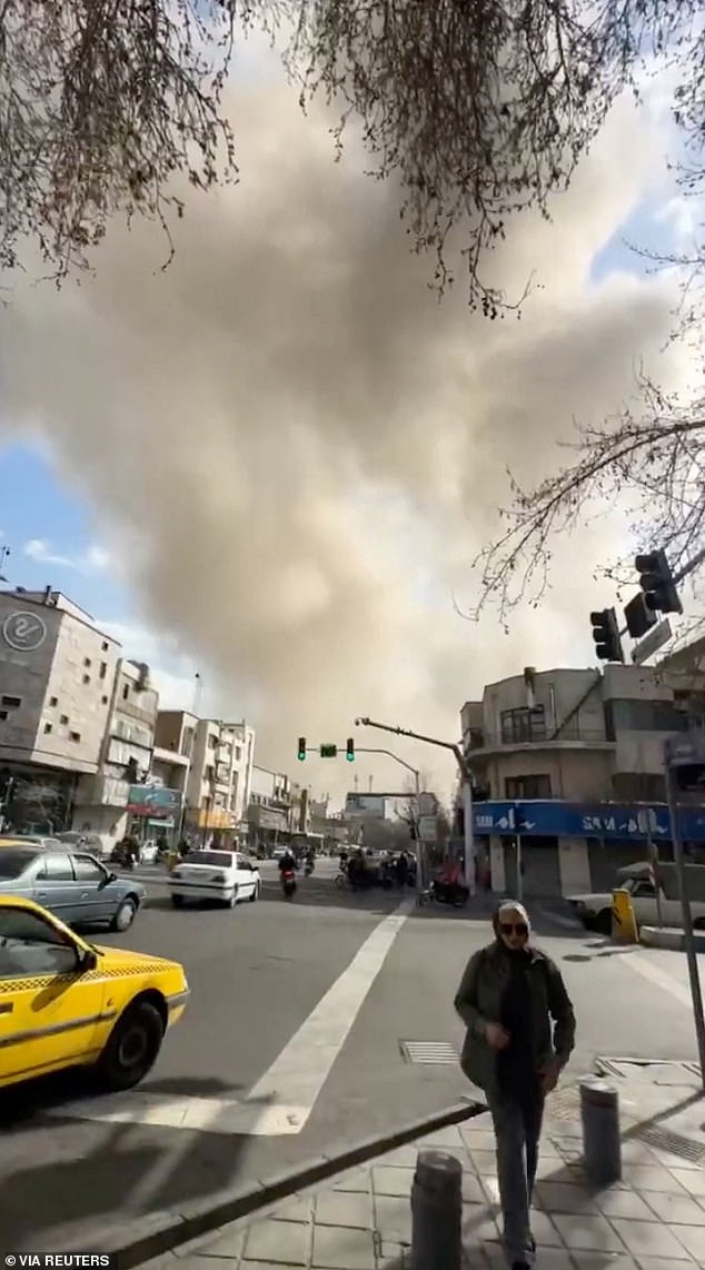 Smoke rises from an explosion in Tehran this morning