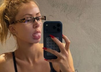 Olivia Attwood kneels down in plunging bra and leggings as she 'pays bikini tax' before getting glammed up for BRITs